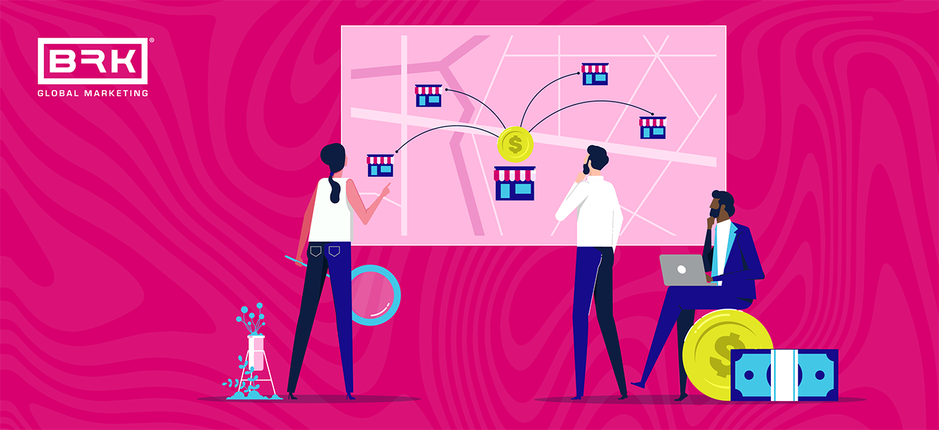 A group of people working on a map for franchise marketing.