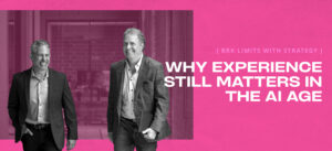 Two men in business casual attire walking together, with text reading: “BRK LIMITS WITH STRATEGY. WHY EXPERIENCE STILL MATTERS IN THE AI AGE.”